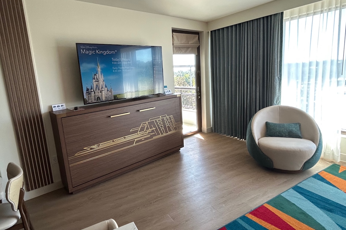 TV, Twin Murphy Bed (closed) and side chair